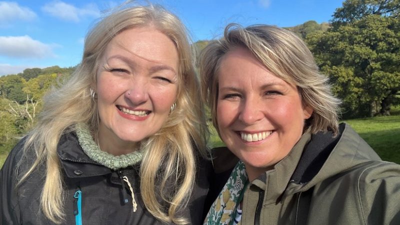 Kelly Peacey and Rev. Helen James smile at the Whiteleaved Oak near the Malvern Hills in Worcestershire, UK